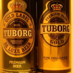 T GOLD LABEL DE LUXE BEER + T GOLD PREMIUM BEER